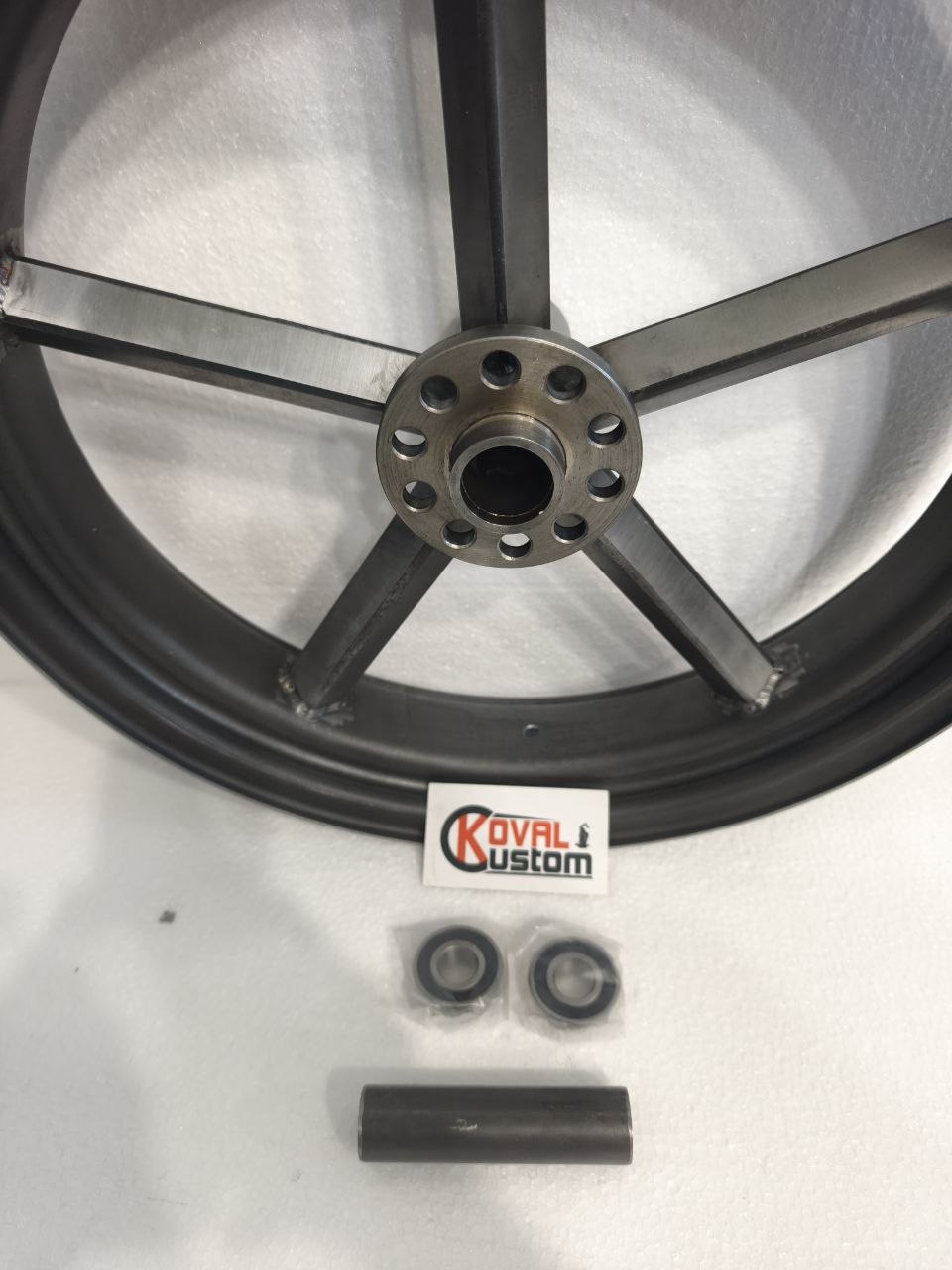 Custom motorcycle rear wheel configured for Harley drum brake