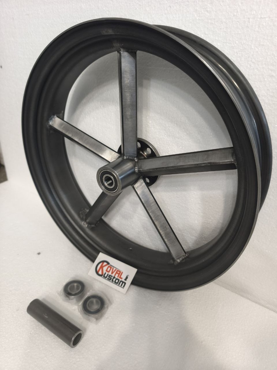 Raw steel 5 square spoke invader wheel hub assembly detail